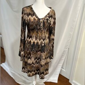 Brand new ARIELLA DRESS IN SIZE LARGE with a bell sleeve, tie at the chest WOT